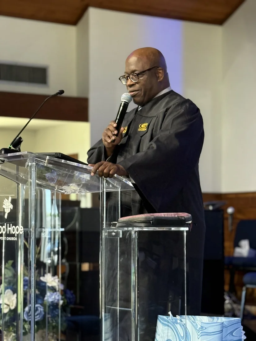 Rev. Timothy Ceasar speaking at the church pulpit